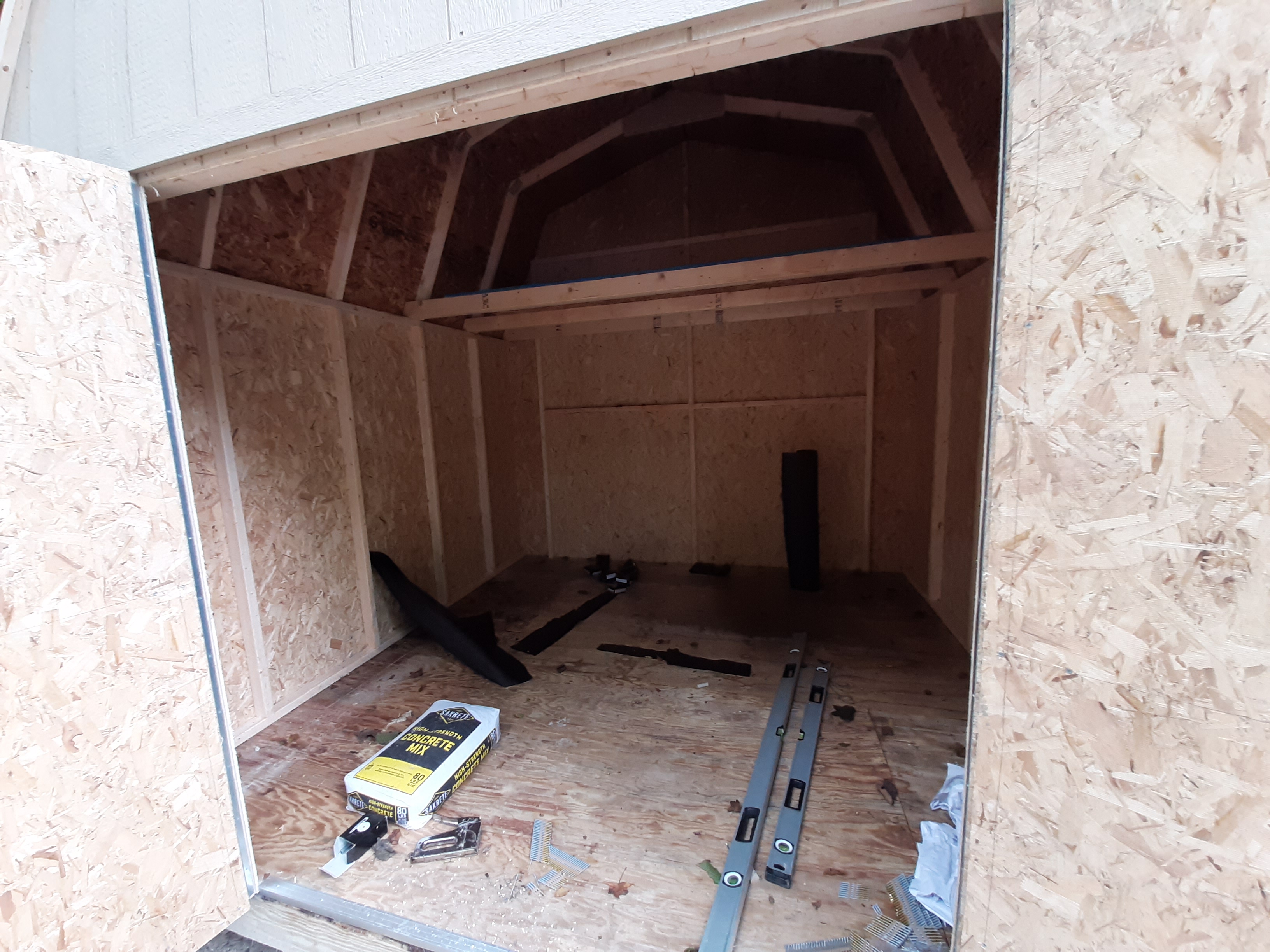 Shed build — walls and roof taking shape