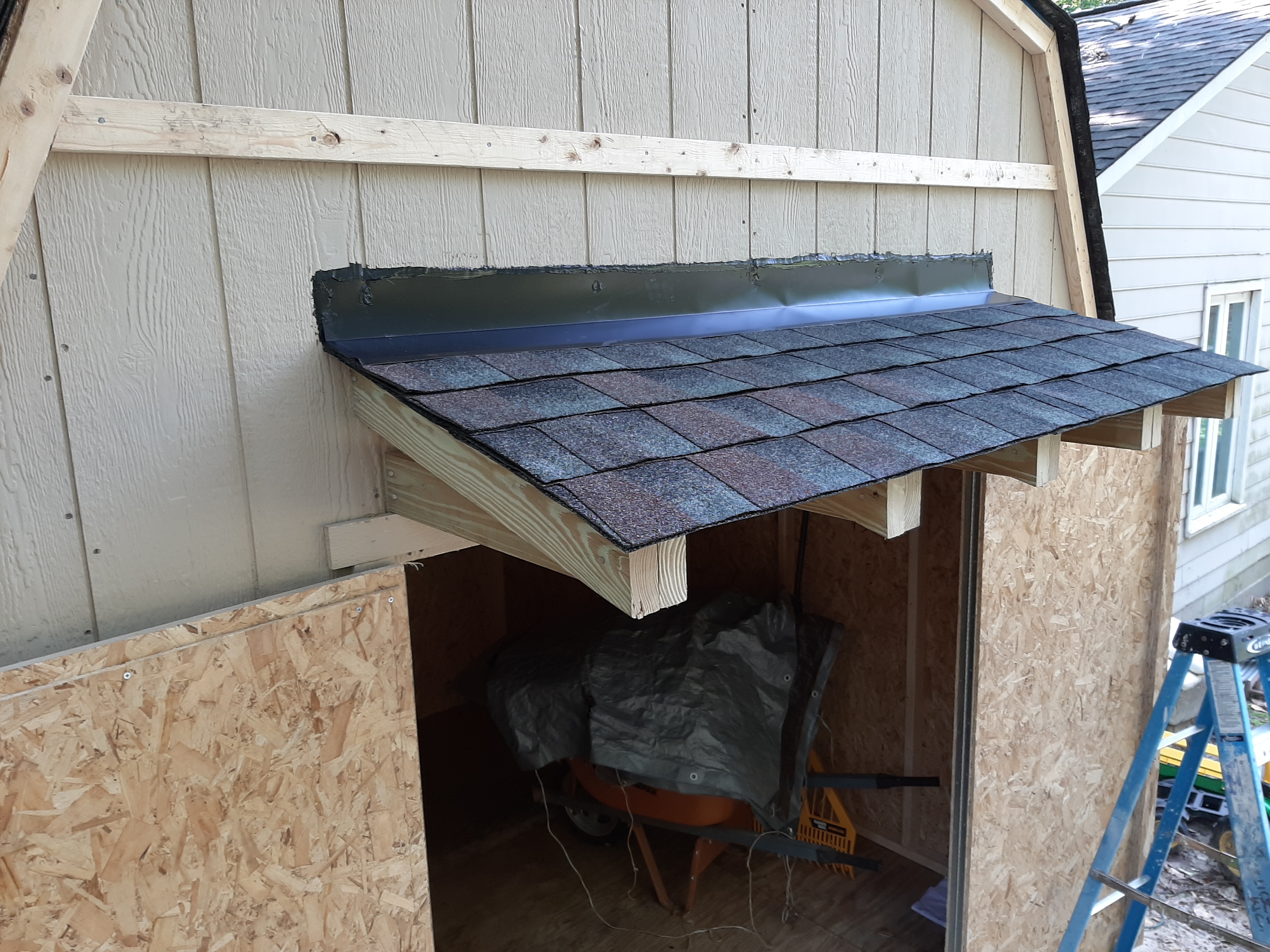 Custom shed — exterior siding installed