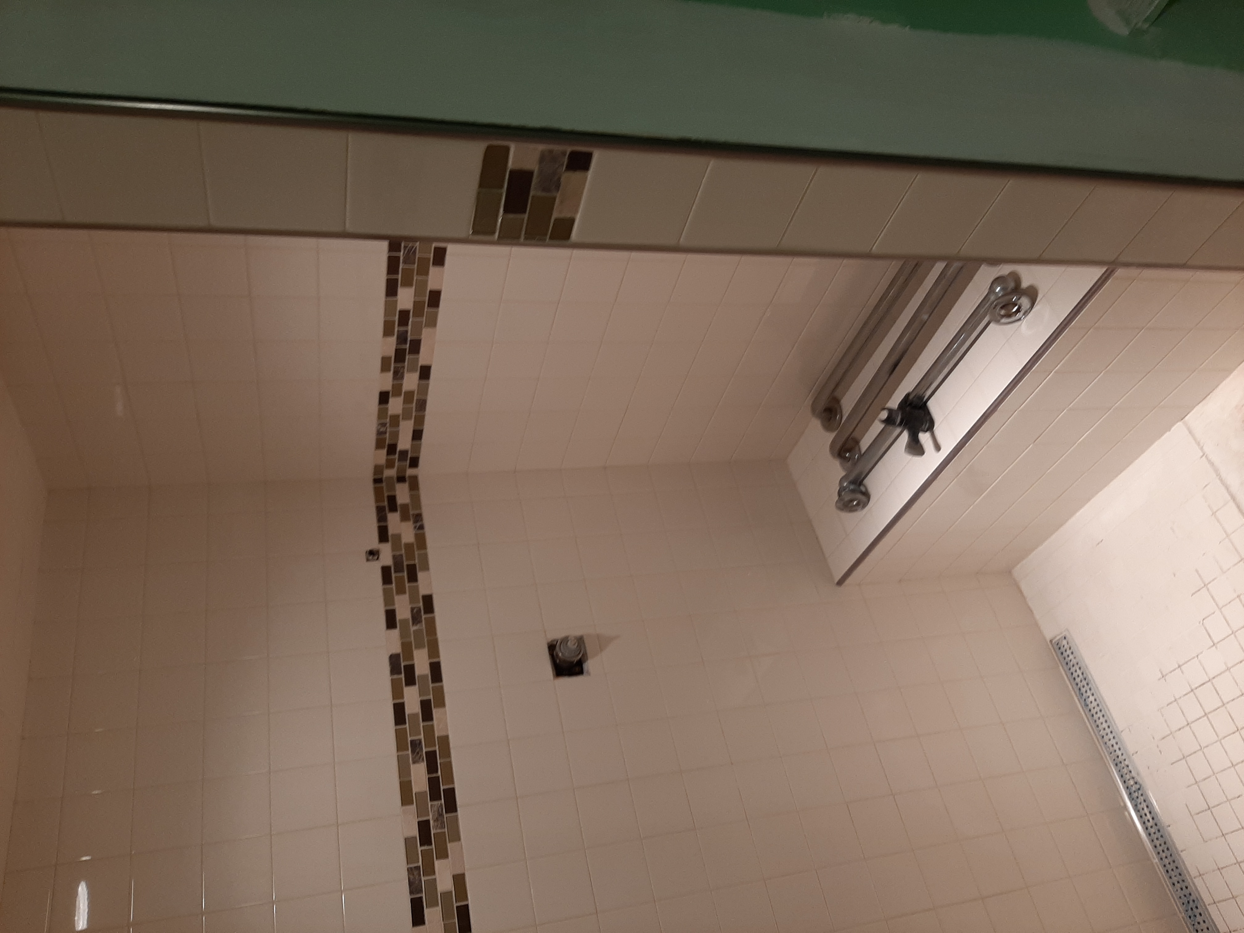 Shower tile installation — mosaic detail
